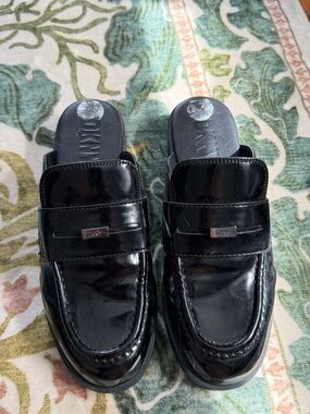 DKNY Black Patent Leather Mules with Logo Plaque